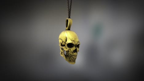 Renderizado-De-Alta-Calidad-De-Un-Pequeño-Colgante-De-Calavera-De-Oro-Brillante,-Balanceándose-Lentamente-Al-Final-De-Una-Cadena-De-Cuello,-Con-Una-Profundidad-De-Campo-Súper-Superficial-Y-Un-Fondo-Bokeh