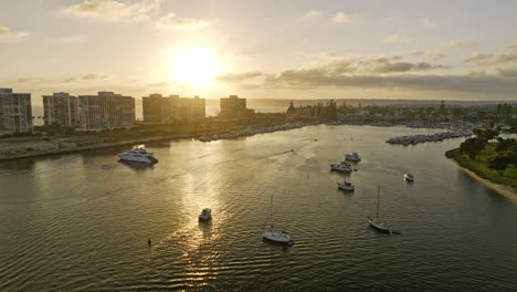 San-Diego-California-Aerial-v101-flyover-glorietta-bay-along-coronado-golf-course-capturing-glowing-sun-setting-on-the-horizon-and-reflection-on-the-water---Shot-with-Mavic-3-Cine---September-2022