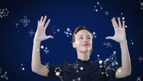 caucasian woman touching molecules on blue background during coronavirus covid19 pandemic