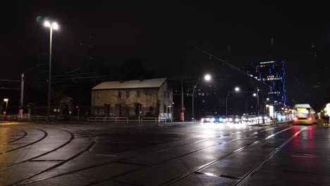 Night-Time-Lapse-of-Wet-Crossing-with-Long-Traffic-Lights-in-Cold-City
