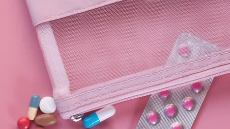 pink medication storage with assorted pills