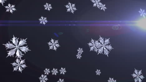 snowflakes falling with light flares on dark background, creating winter scene