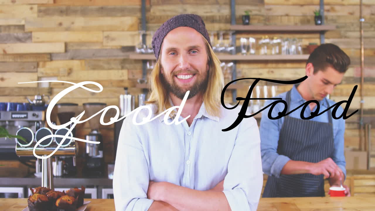 Smiling man in cafe with Good Food text animation over rustic background