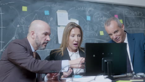 business partners sitting at table in boardroom