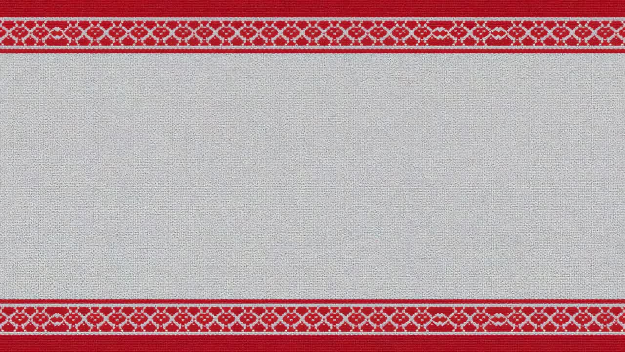 Animation starting, red diamond motifs appearing, forming row on woven cloth panel with red borders