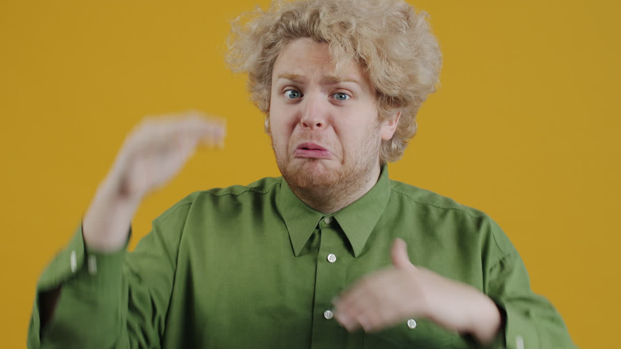 Man making a silence gesture