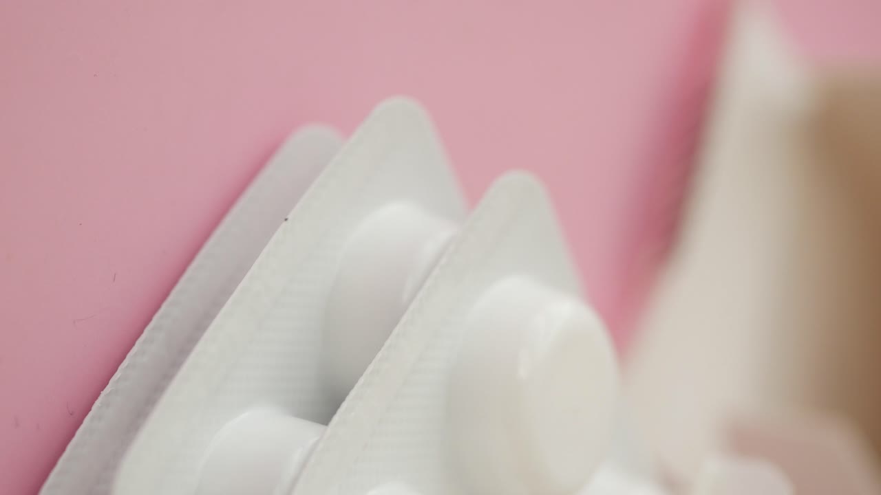 Close-up of White Pills in Blister Pack