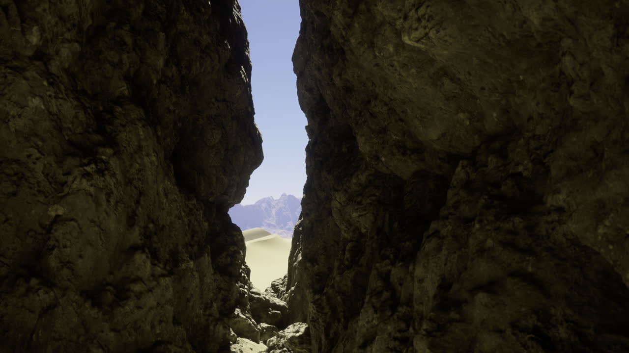 Exploring a narrow passage between towering rock formations under clear skies