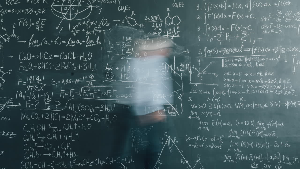 Professor in front of a chalkboard full of mathematical equations