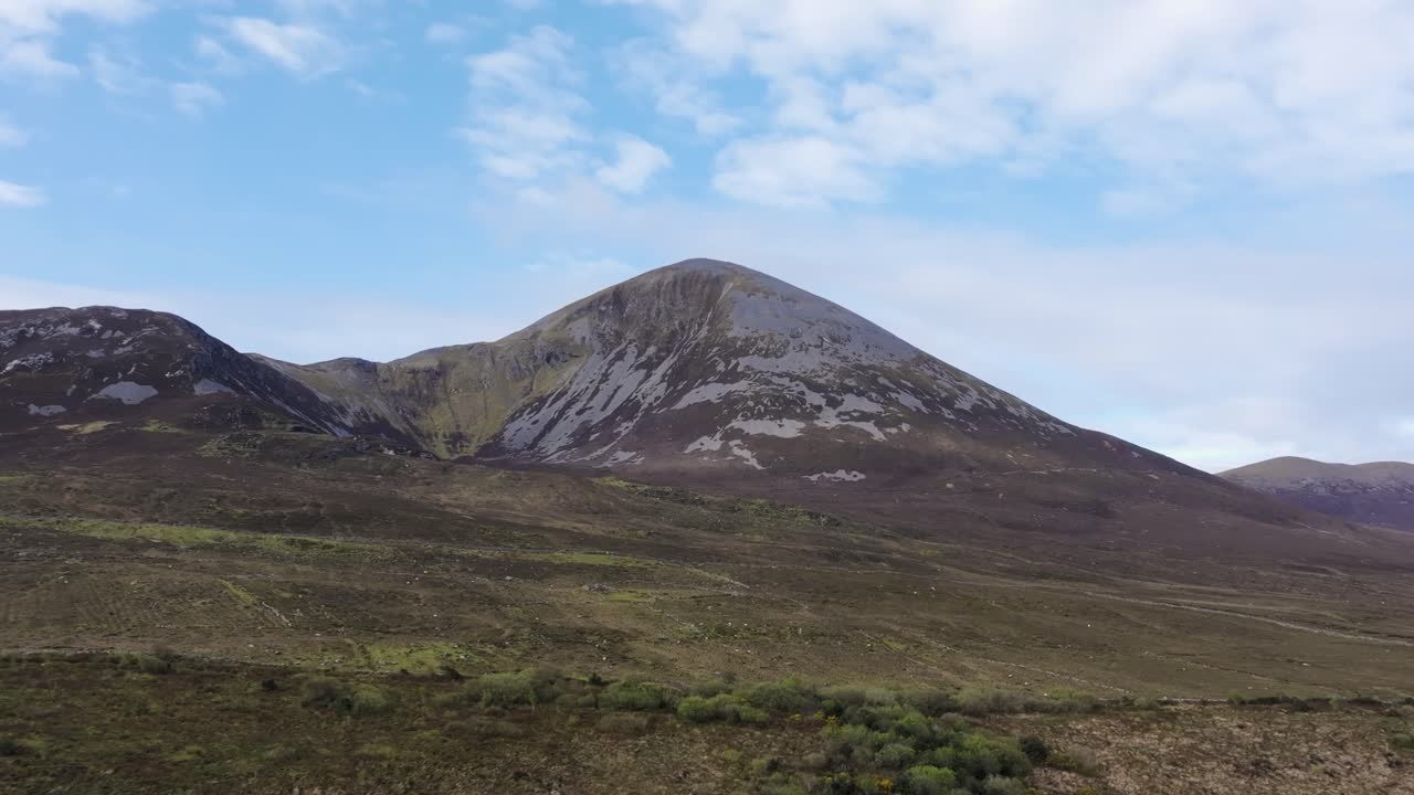 Panoramic View of a Majestic Mountain Landscape Under a Blue Sky