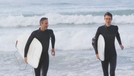 father and young adult son enjoying outdoor activities together