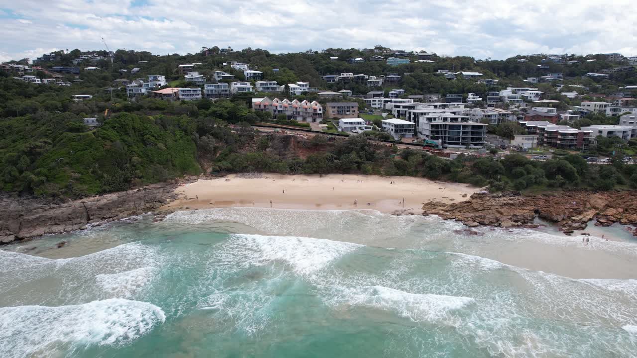 Coolum Beach, Beachgoers And Waves Crashing In The Coastline In Sunshine Coast, QLD, Australia. - aerial shot