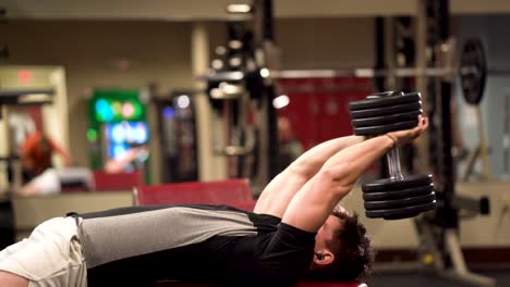 Closeup-side-shot-of-bodybuilder-doing-lying-triceps-pullover-or-presses