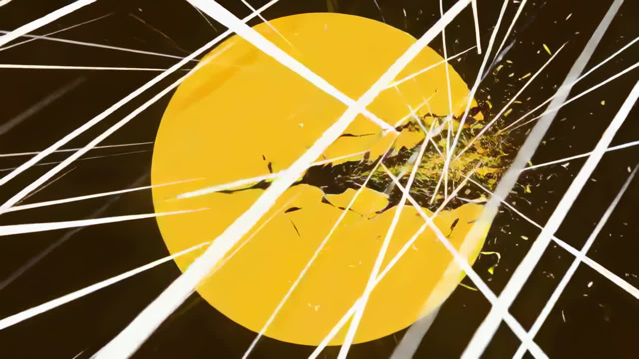 Cracking centered yellow disc as white streaks striking right edge ejecting chips in dark void
