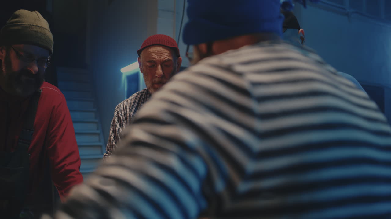 A group of men socialising and playing an informal game