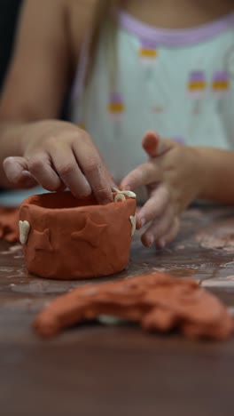 children making clay decorations