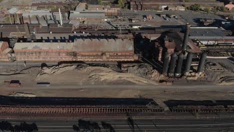 aerial panning backward from an old steel mill slated for demolition