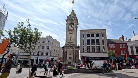 people walking near brighton clock tower