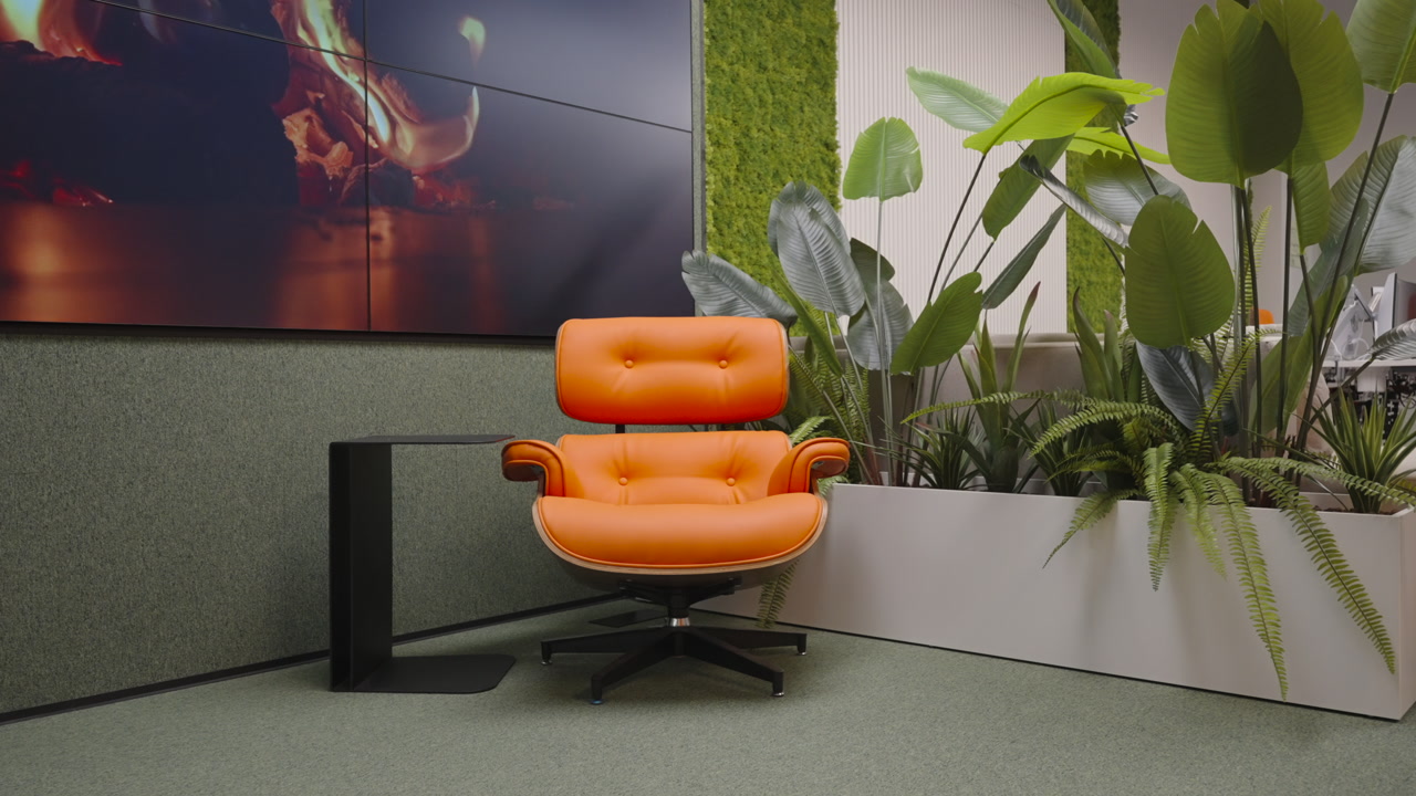 Orange Lounge Chair With Fireplace And Lush Plants In Modern Office Relaxation Corner, Moss Wall And Wall. Creative