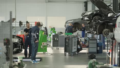 cars undergoing maintenance in auto repair shop