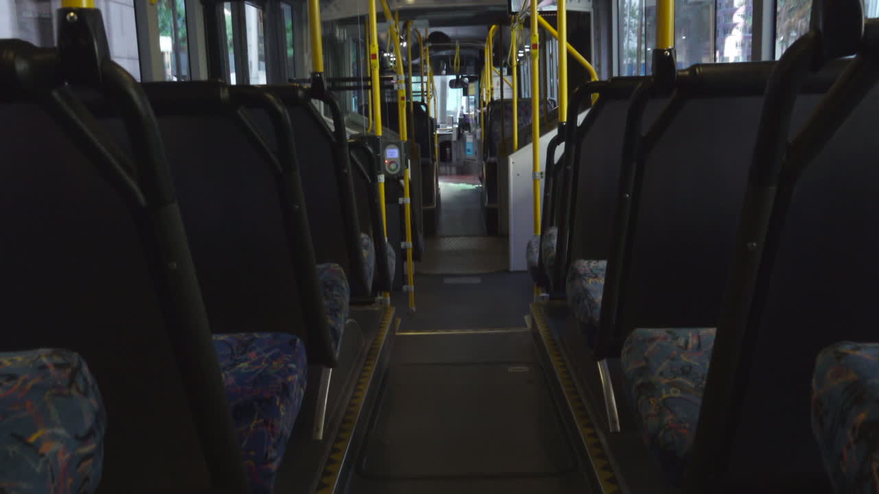 Empty bus driving through the streets of Sydney during Covid 19 Coronavirus Pandemic
