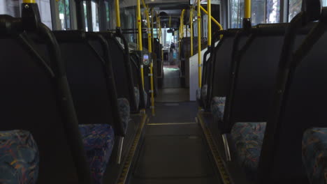 empty bus driving through the streets of sydney during covid 19 coronavirus pandemic