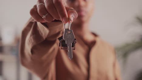 african woman tenant hold keys recommend real estate agency or broker
