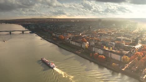 Drone-City-shot-of-Mainz-the-City-of-Biontech-vaccine-against-Corona-Covid-19-in-Germany-from-an-aerial-view-in-golden-fall-light-and-dramatic-Sky