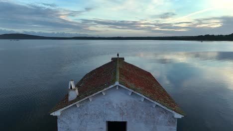 old boat shed rusting away on the banks of menorca