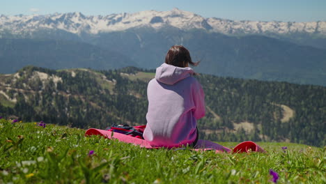 woman relaxing in mountains