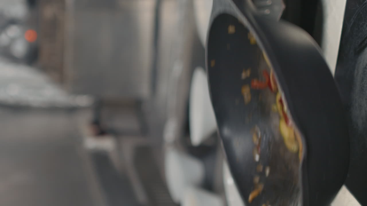 Chef Tossing Vegetables In Wok Pan