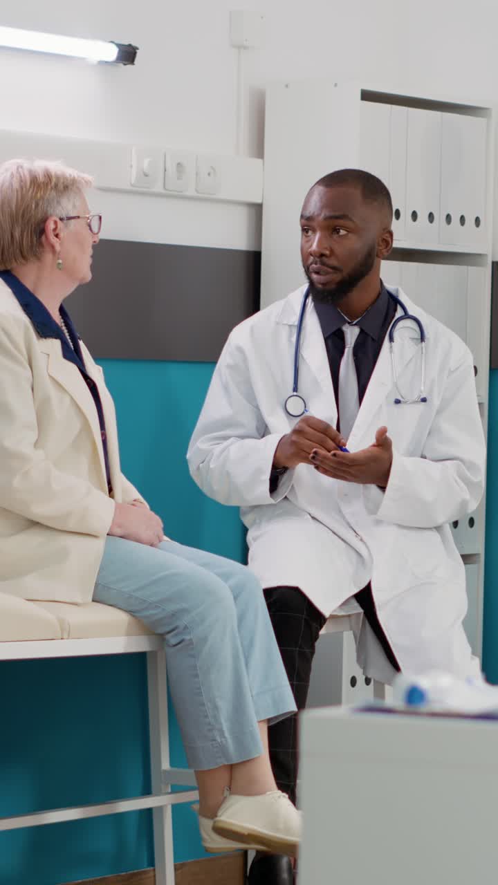 Doctor Consults with Patient in Clinical Setting