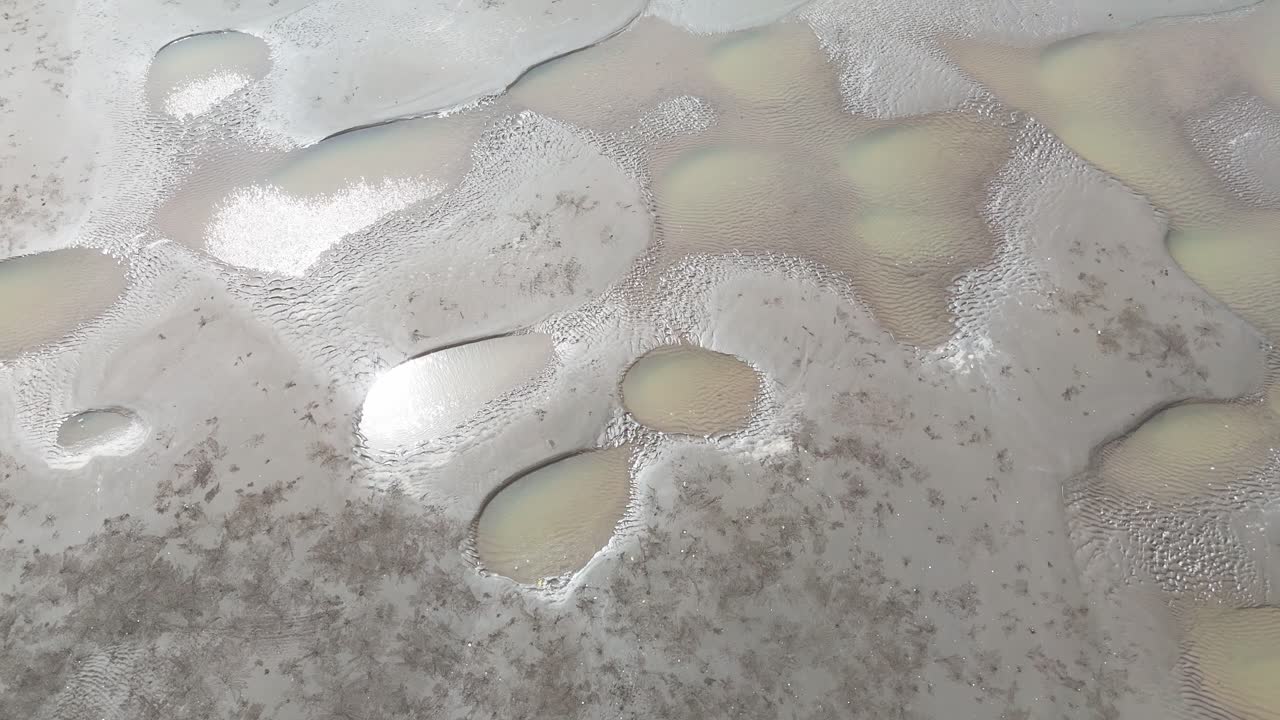 Aerial View Tilt of the Wind Farms at the Sea in Ben Tre.
