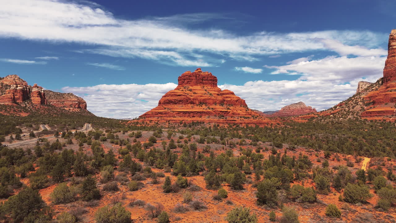 Approaching Bell Rock and Cathedral Rock in Sedona, Arizona, United States. Aerial Drone Shot