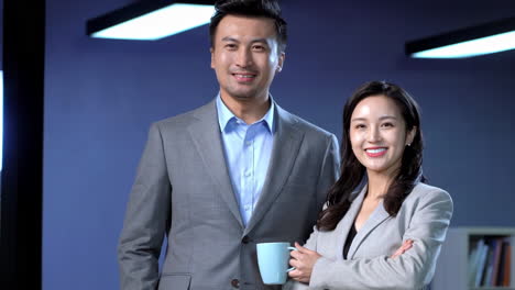 professional businessman businesswoman standing confidently gesture of positivity, approval, look at camera with enthusiastic and joyful expression. celebrate success, acknowledgment of job well done