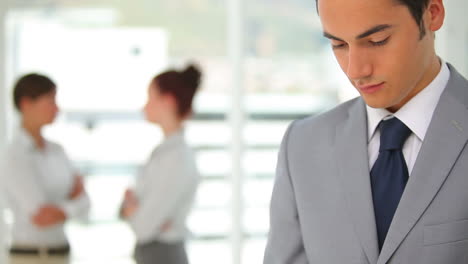 Business-man-looking-at-his-mobile-phone