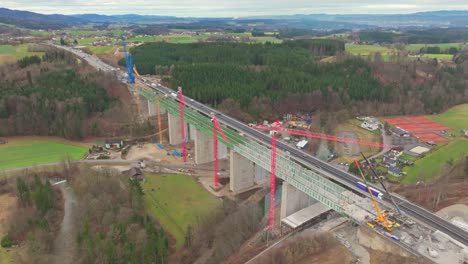 Towering-Cranes-In-The-Construction-Site-Of-A-Bridge-For-A-Highway