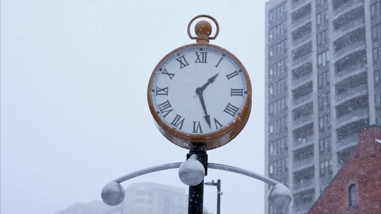 Street clock during a snowstorm