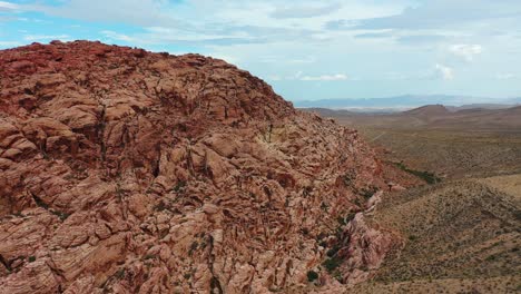 Cinematic-Drone-Shot-of-the-Grand-Rock-Formations-and-Peaceful-Valleys-at-Red-Rock-Canyon-National-Conservation-Area,-Nevada