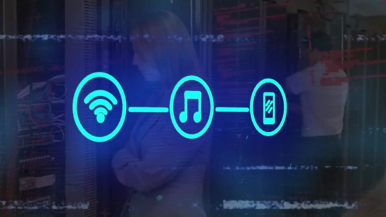 Animation of media icons over caucasian workers in server room