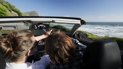 Couple-driving-convertible-car-cabriolet-cape-town-south-africa-steadicam-shot