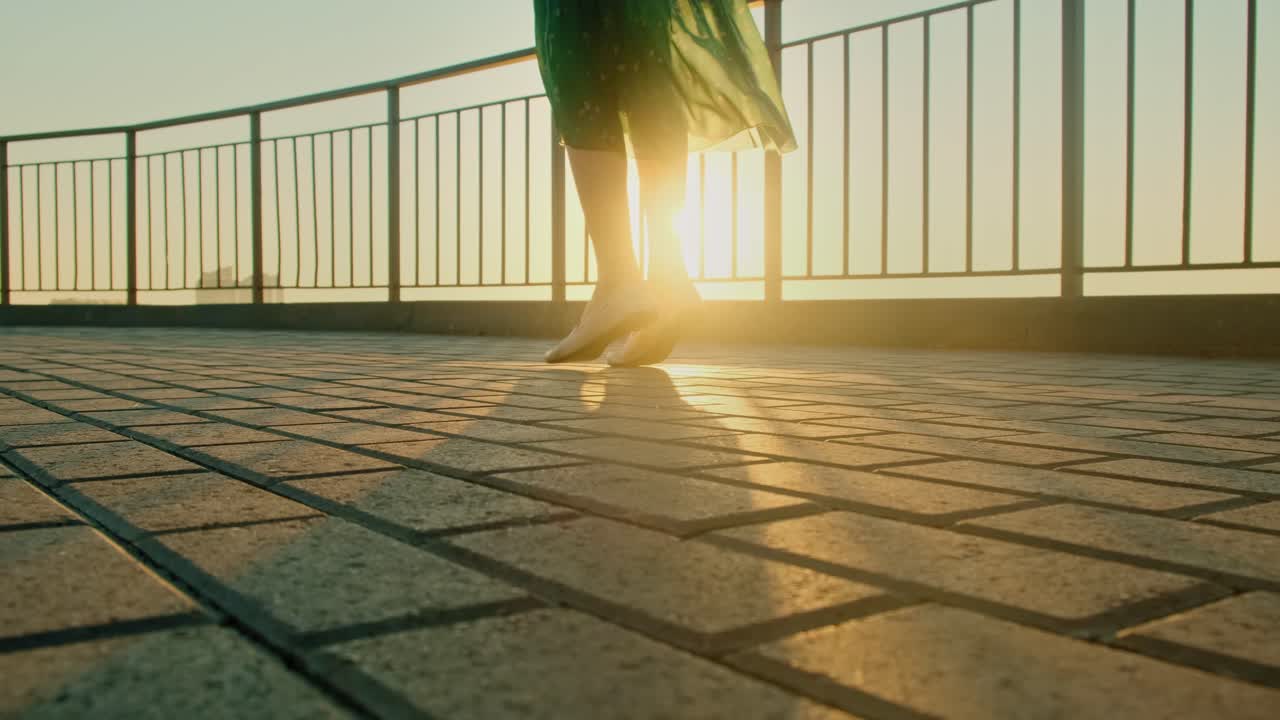 Woman Walking at Sunset on Balcony