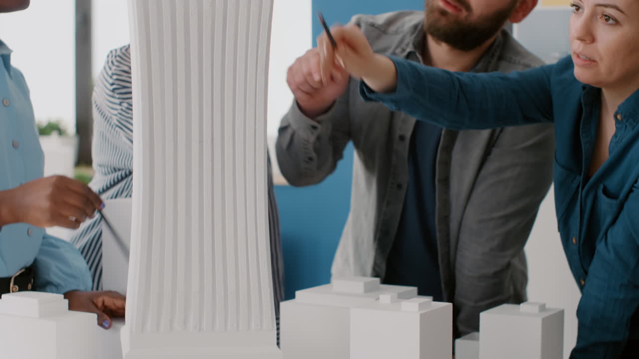 Architects Discussing Building Scale Model