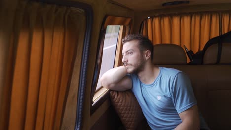 young man traveling in car.