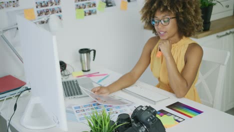 Confident-woman-working-with-photos