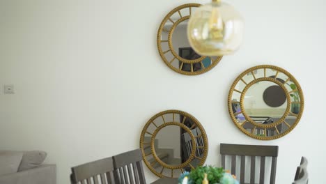 dining room with table, chairs and mirrors