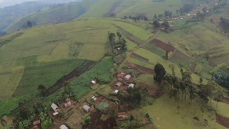 low misty aerial flight, steep hilly agri crop fields in congo, africa