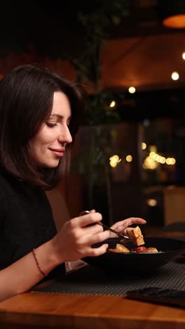 woman enjoying a meal in a restaurant