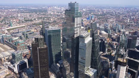 Aerial-close-in-view-of-Londons-Towers-including-the-Nat-West-Tower,-Leadenhall,-Bishopsgate-and-the-Gherkin