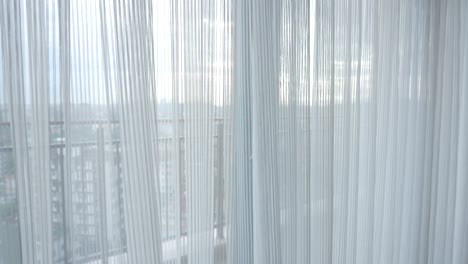 white curtains with city view